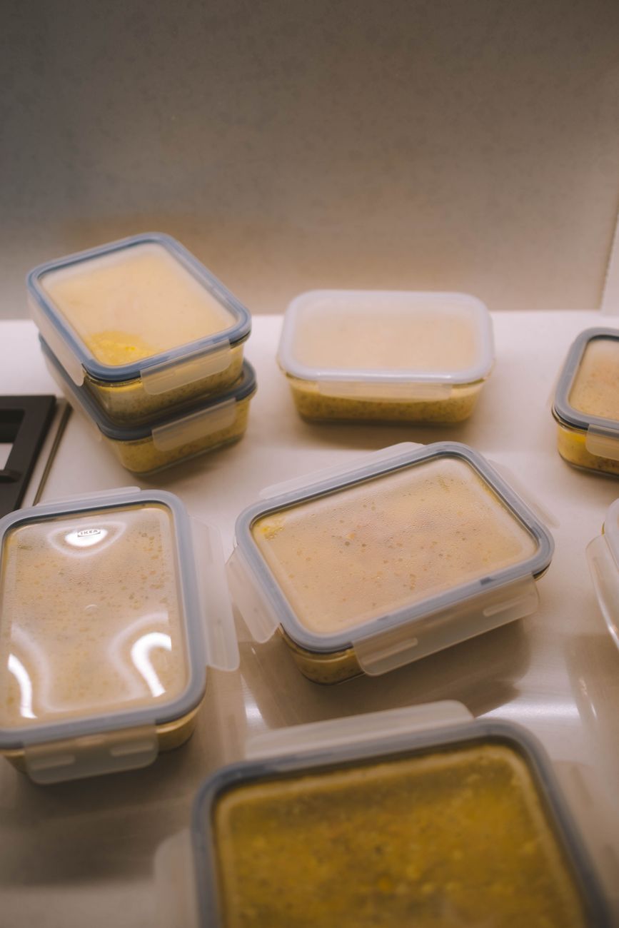 meal prep containers of high protein low carb meals stacked in the fridge ready for the week