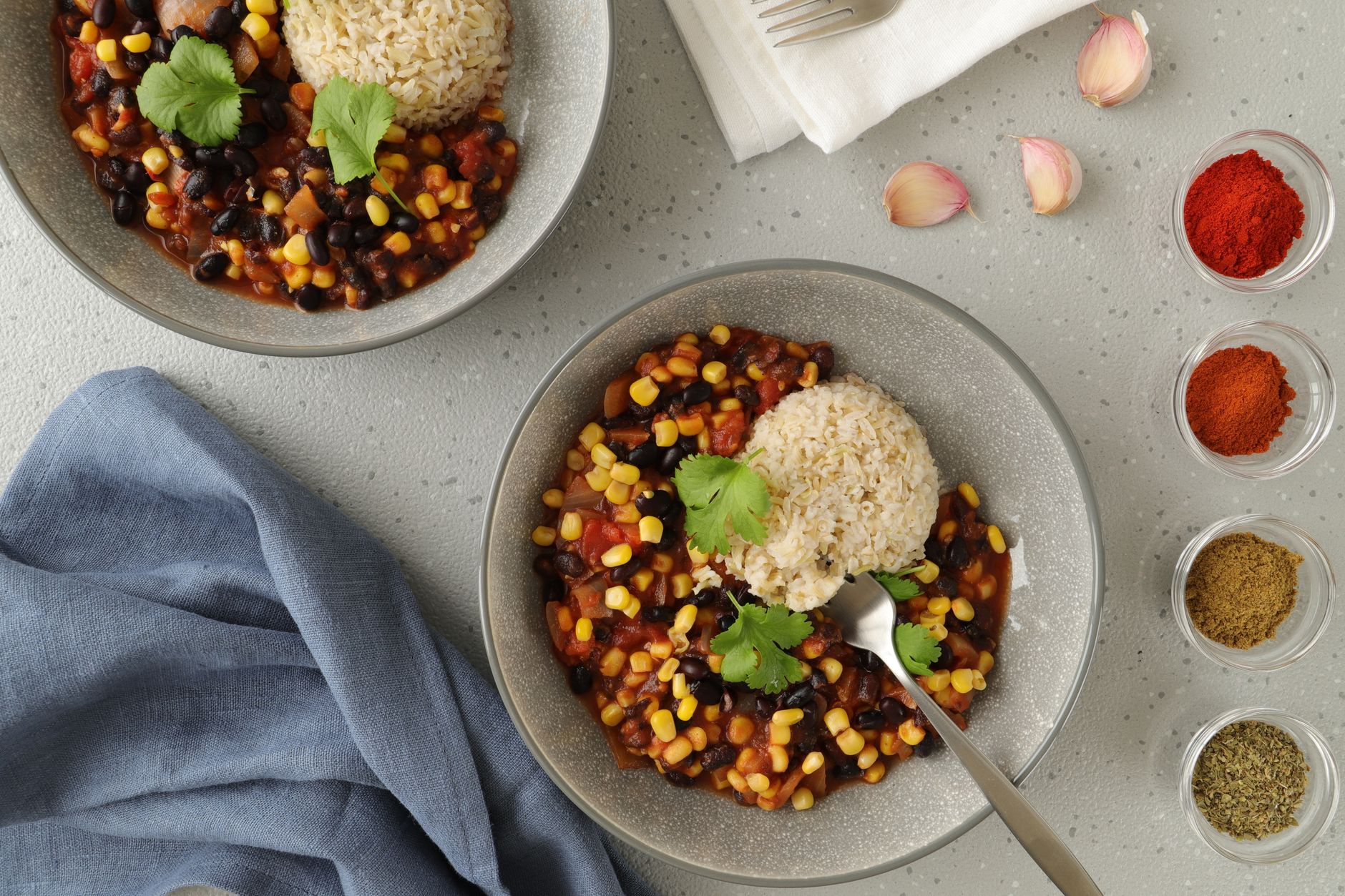 simple meal prep ideas of rice beans and roasted vegetables in storage containers