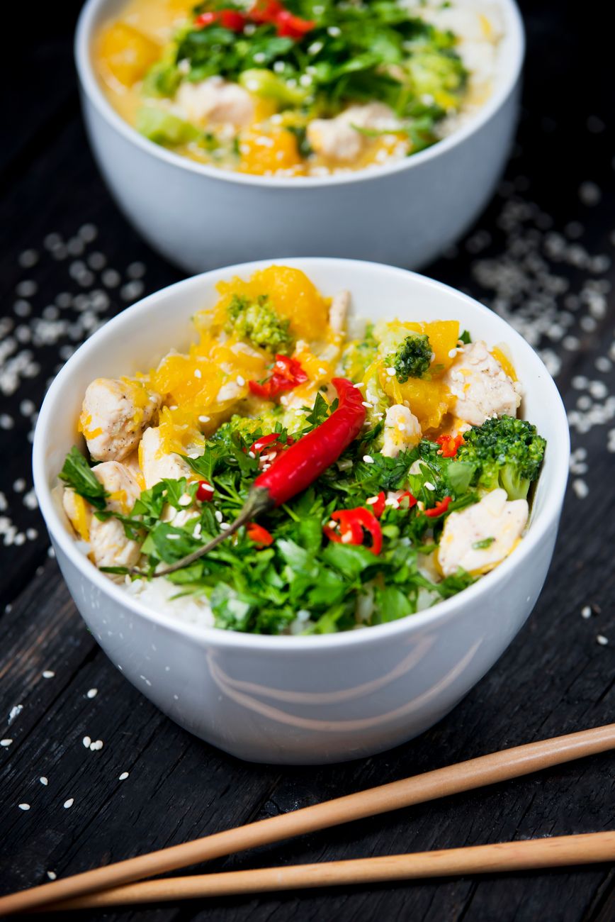 an easy crockpot meal of shredded chicken served over rice in a bowl