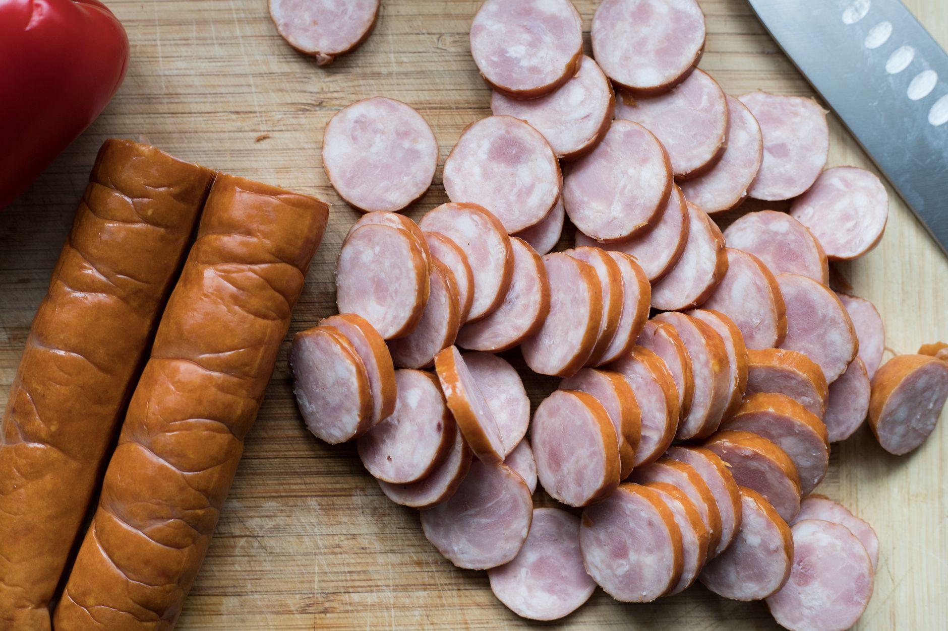 sliced smoked sausage and bell pepper prepped for a five ingredient keto sheet pan dinner