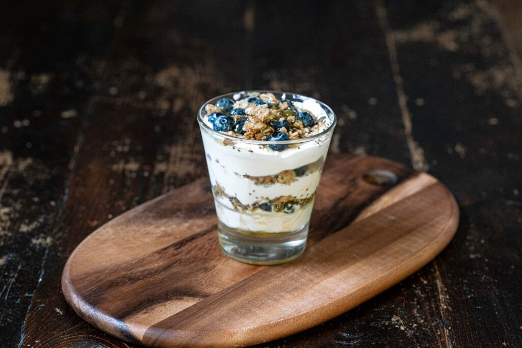 greek yogurt parfait jars layered with berries for healthy breakfast meal prep