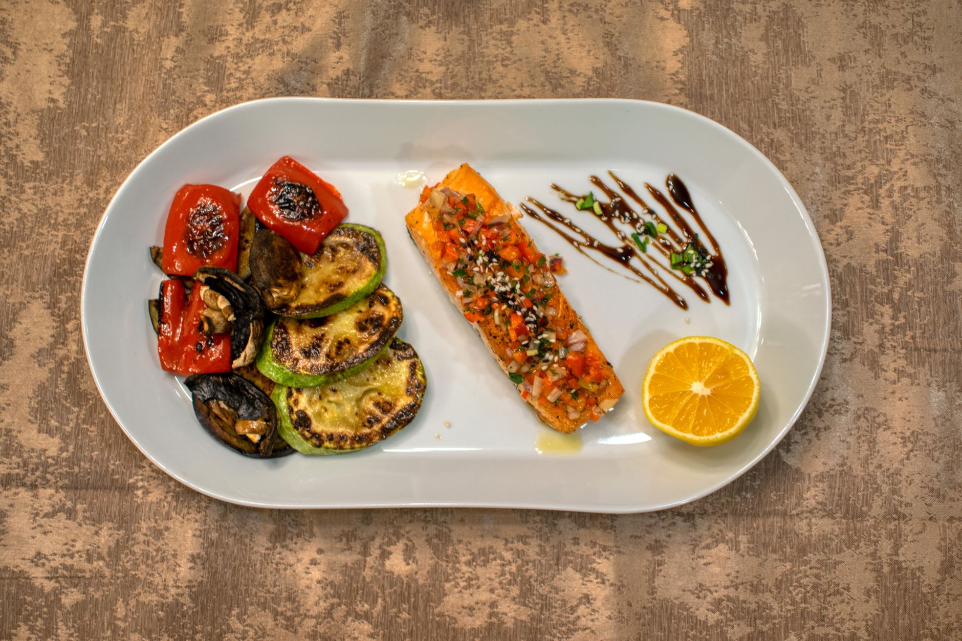baked keto salmon with roasted zucchini and peppers portioned for meal prep