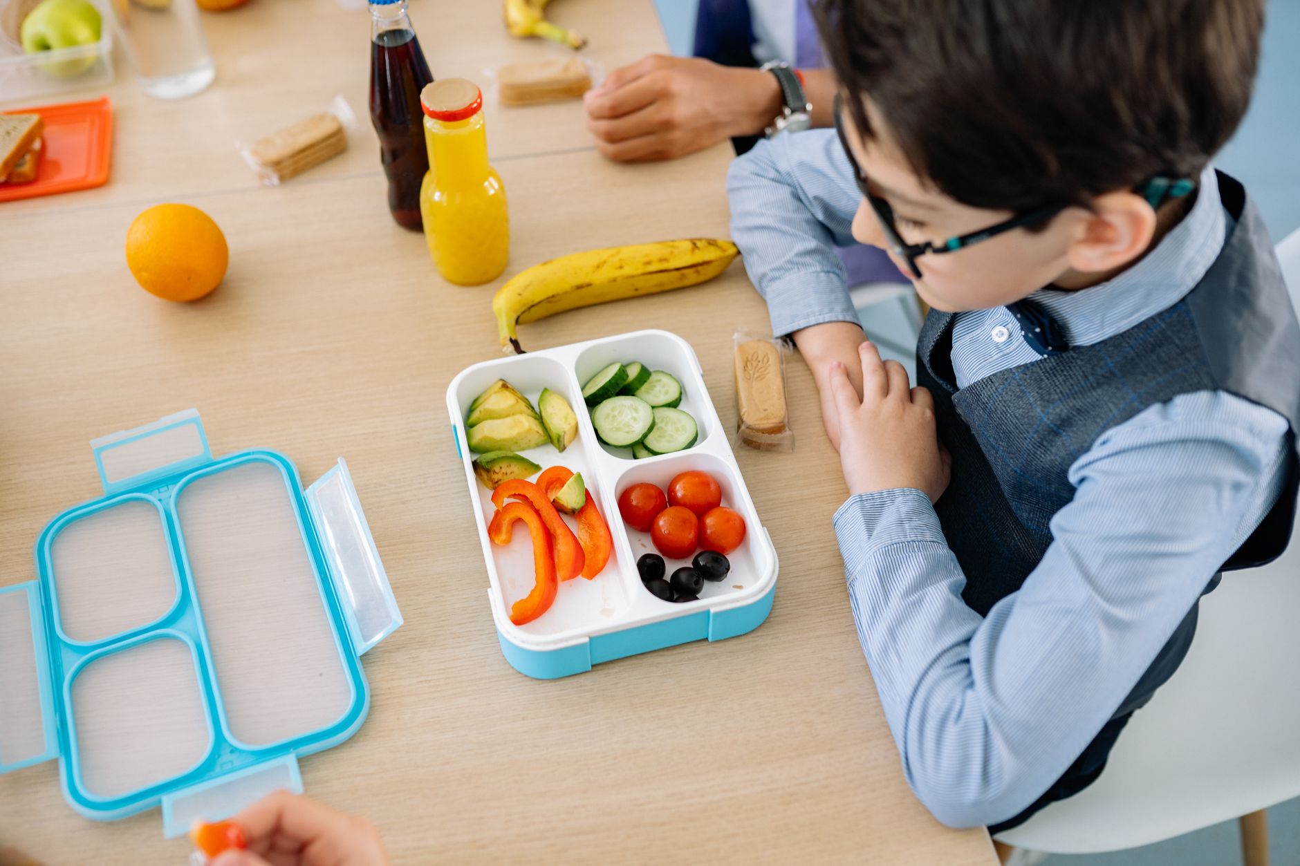 kid-friendly bento lunch box with fruit, veggies, cheese and a protein