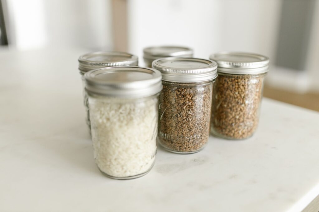 make ahead breakfast jars of overnight oats and chia pudding lined up in the fridge
