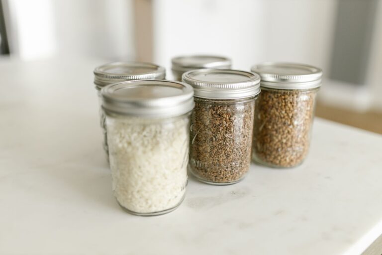 make ahead breakfast jars of overnight oats and chia pudding lined up in the fridge