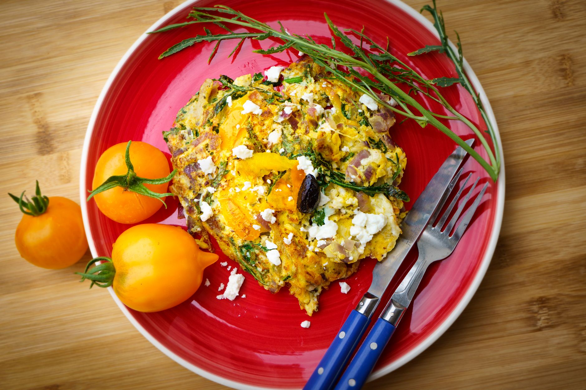 make ahead keto egg bites with spinach and feta in a muffin tin