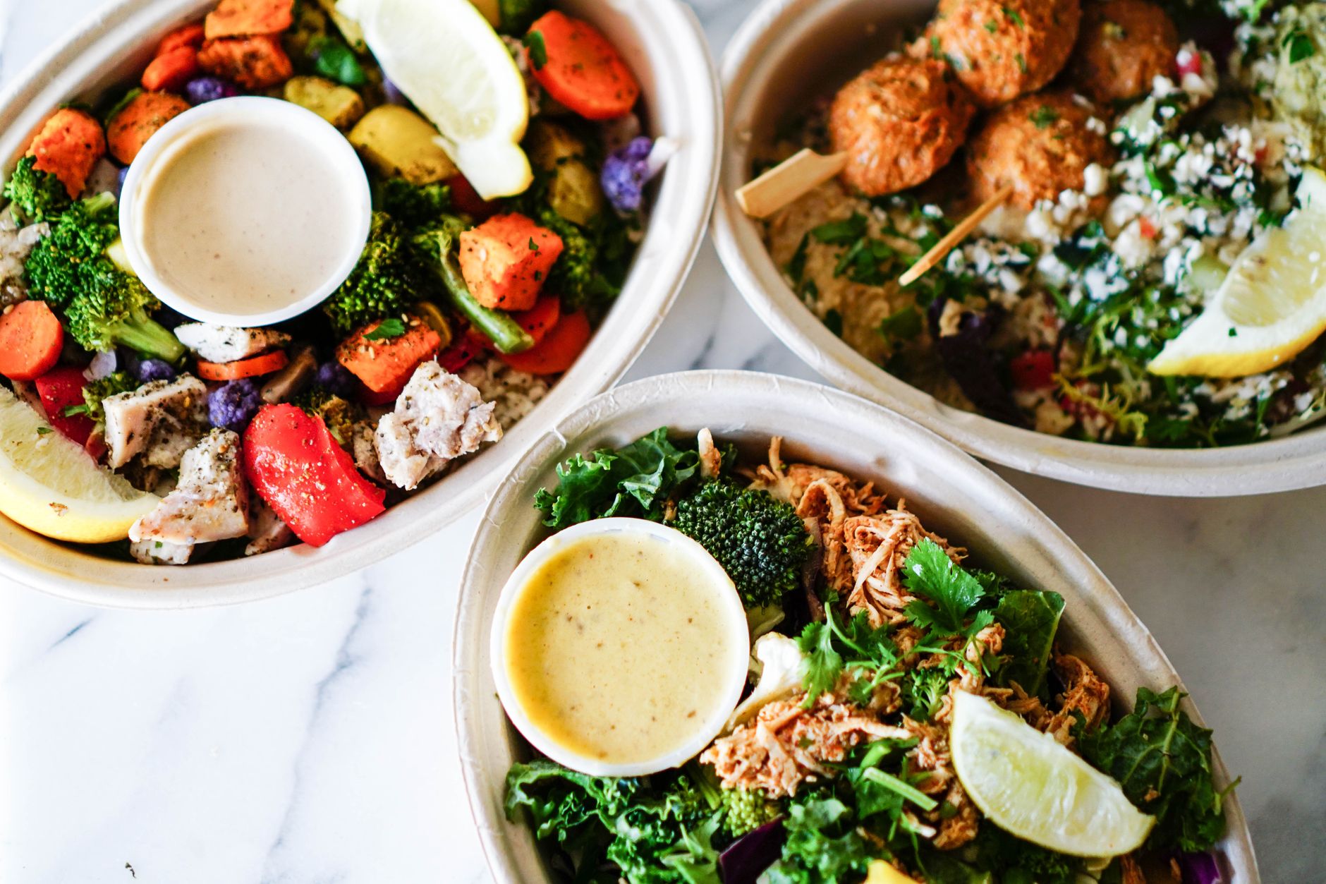 component style plant based meal prep with separate containers of cooked lentils, grains and roasted vegetables