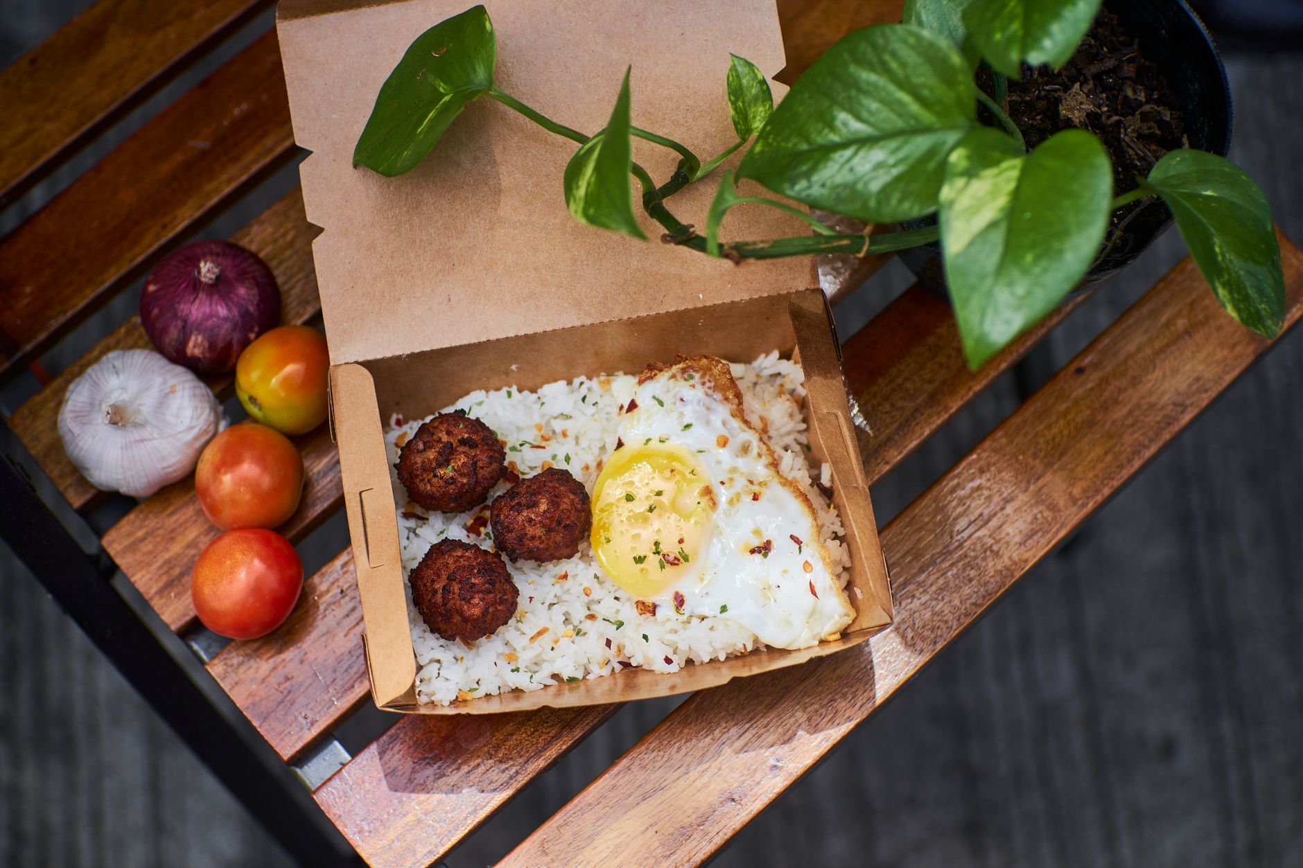 portioned grab and go breakfast box with egg muffins and fruit ready to take to work