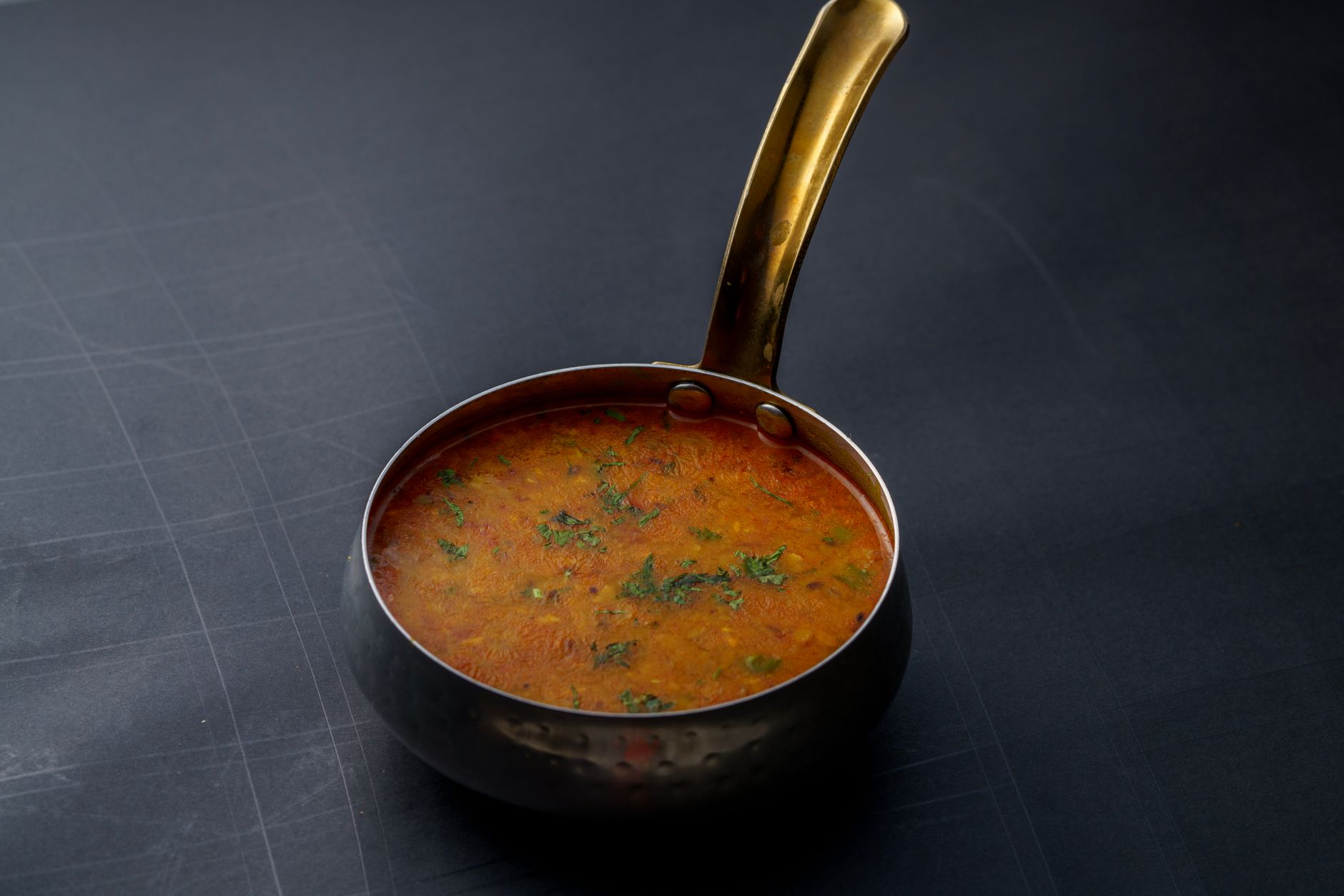 red lentil coconut curry cooked in a pot for a cheap dinner idea