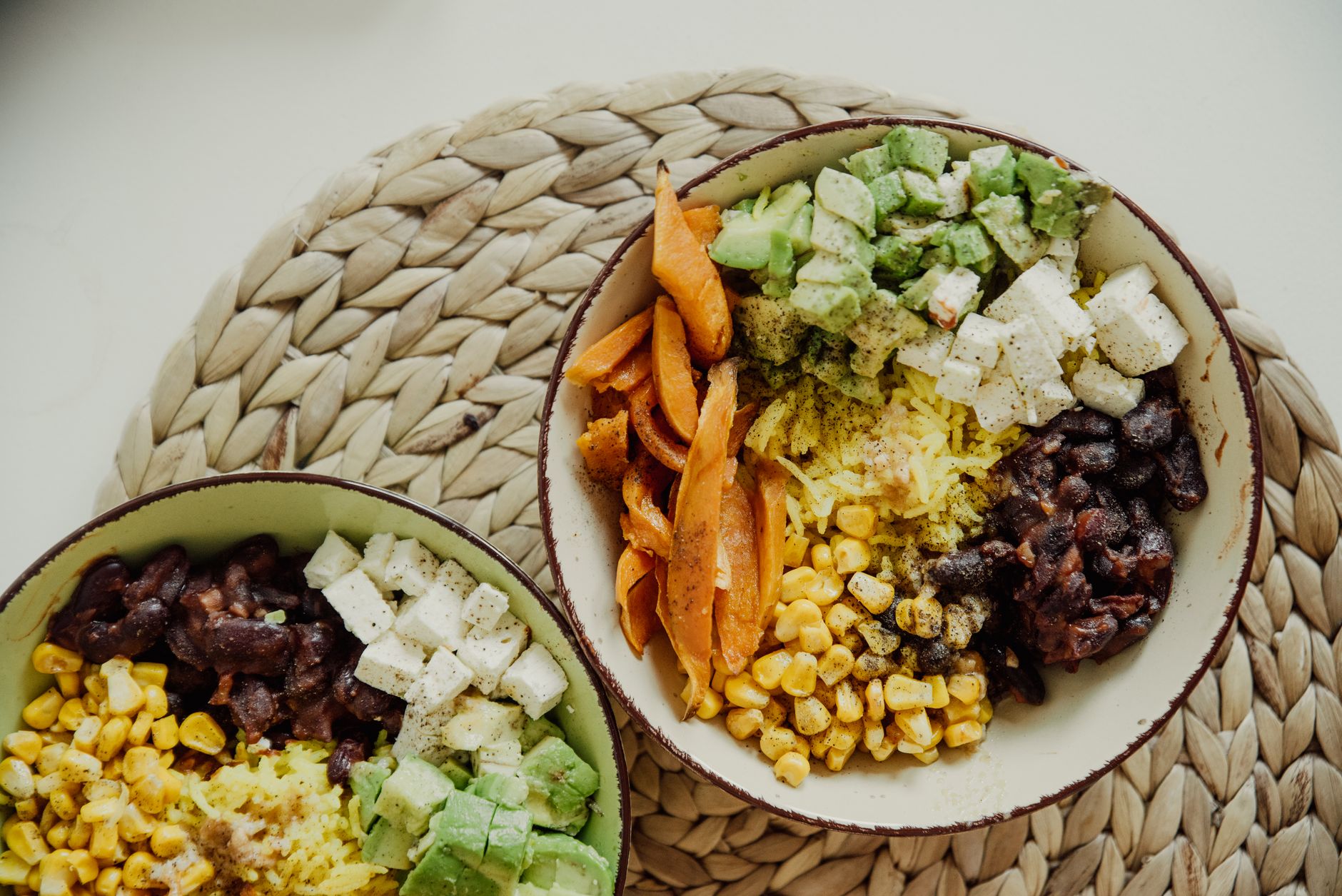 taco bowls with rice, black beans, corn, and cheese for cheap meal prep